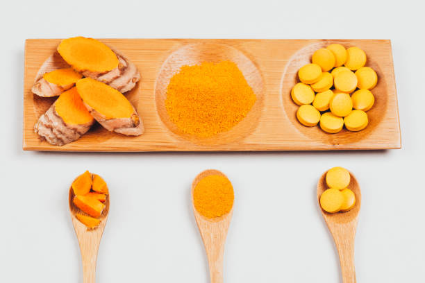 istock Turmeric in different conditions: dry root, tablets, powder and cut plant. 1226673558