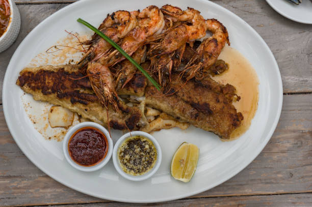 istock Seafood platter with grilled prawns and fish with sauces 1226673707