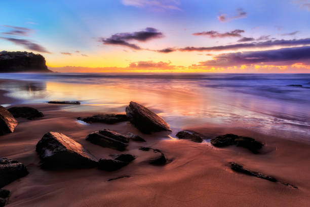 istock Sea BB Dark Sand Dark Stones 1226677056