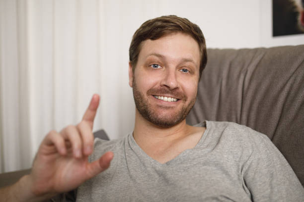 istock Man talking on a video chat first person 1226678805