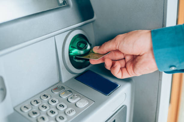 istock Man is withdrawing money from an ATM. 1226681936