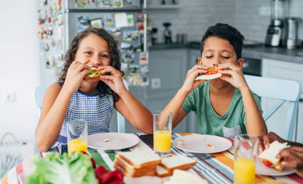 istock Children eating sandwiches. 1226681948