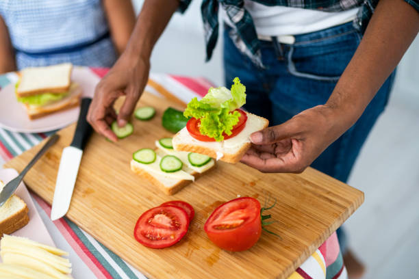 istock Young woman making a sandwich. 1226681959