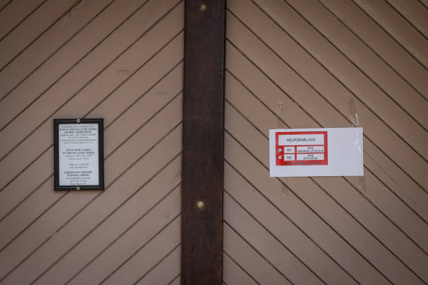 Damage church building after a strong earthquake Zagreb, Croatia - 12 April, 2020 : A sign prohibiting the use of the building on the church door after a strong earthquake of 5.5 on the Richter scale in Markusevac, Zagreb, Croatia. zagreb earthquake stock pictures, royalty-free photos & images