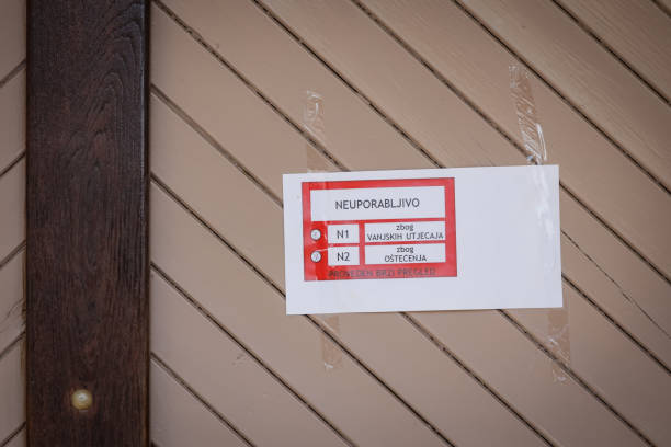 Damage church building after a strong earthquake Zagreb, Croatia - 12 April, 2020 : A sign prohibiting the use of the building on the church door after a strong earthquake of 5.5 on the Richter scale in Markusevac, Zagreb, Croatia. zagreb earthquake stock pictures, royalty-free photos & images