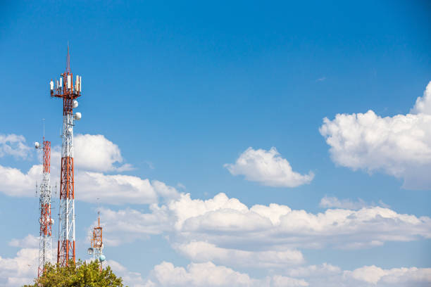 Mobile phone transceiver mast stands against a moody sky.