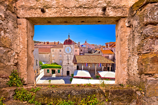 UNESCO Town of Trogir main square viewthrough stone window, Dalmatia region of Croatia