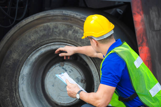 istock Mechanics checking wheel in cargo container. Professional technician pre-check forklift truck tires, safety concept. 1226692204