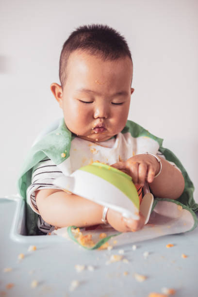 istock Mischief baby when eating food 1226694795