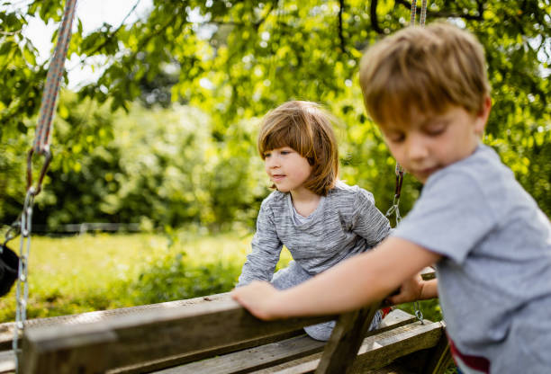 istock Two young boys hanging out in a public park 1226705837