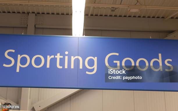 Motion Of Sporting Good Sign On Sport Equipment Section Inside Walmart Store Stock Photo - Download Image Now