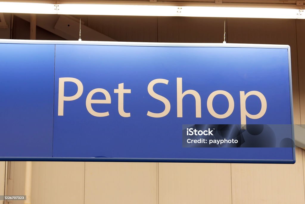 Motion of pet shop sign on top inside Walmart store Business Stock Photo