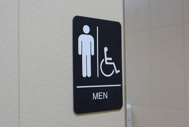 istock Motion of man and disable washroom logo on wall 1226707327