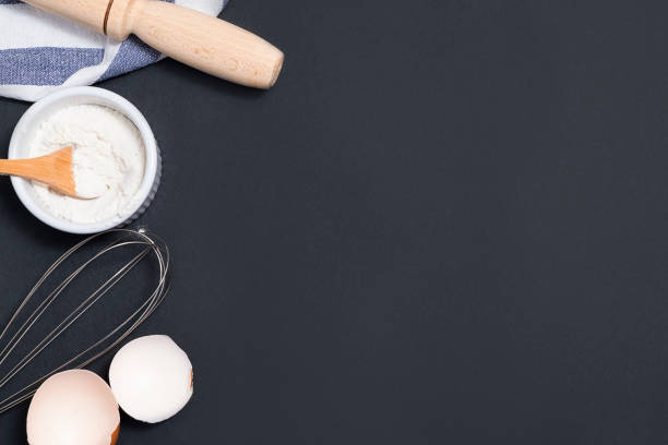 istock Top view of backing background with flour, rolling pin, eggshells, utility whisk with copy space 1226708314