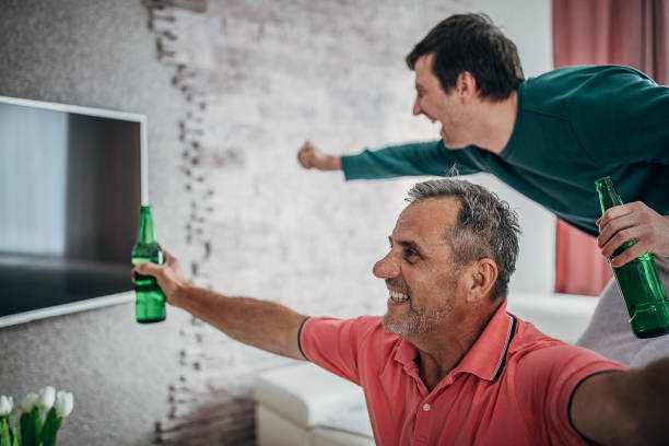 istock Sports cheering watching tv 1226709268
