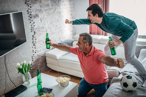 istock Sports cheering watching tv 1226709655