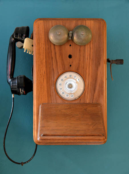 istock Vintage telephone hanging on a wall 1226712073