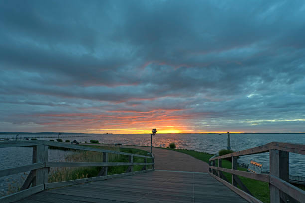 istock Bridge and promenade with majestic cloudscape at sunset 1226718466