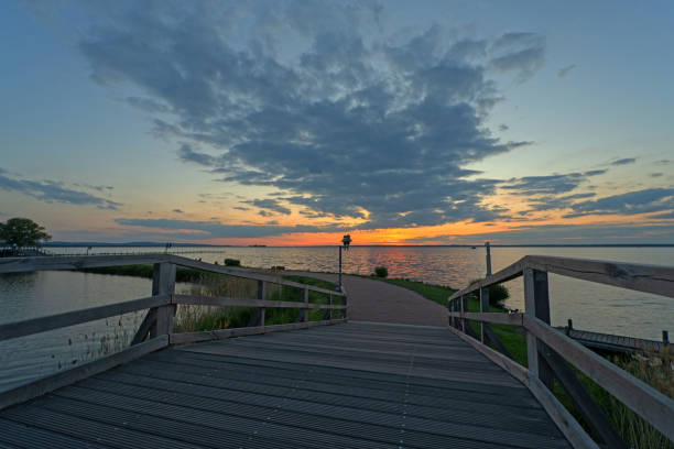 istock Bridge and promenade with majestic cloudscape at sunset 1226718557
