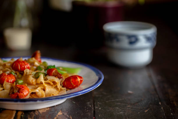 istock Chinese homemade chow mein, with crawfish and leaf vegetable 1226721343