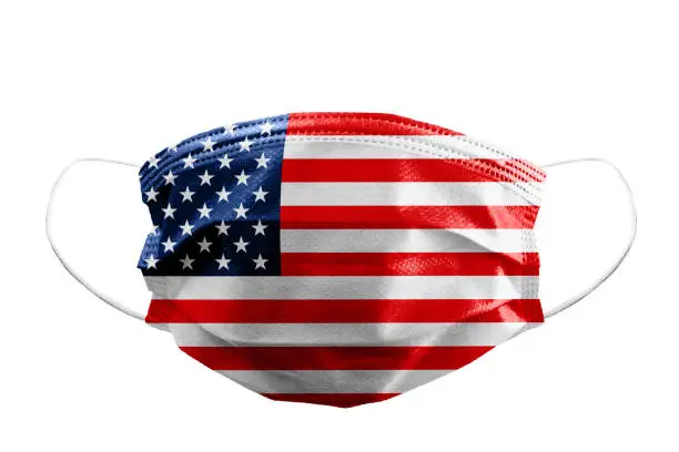 Frontal view of surgical mask USA or American flag isolated with rubber ear straps to cover the mouth and nose to protect face from virus