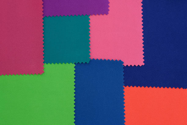 istock Samples of fabrics in different colors. Blue, green, pink piece of fabric with texture. 1226723708