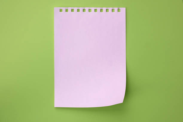 istock White torn sheet of notebook on light green background, top view. 1226723781