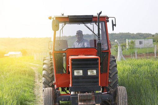 farmer driving tractor