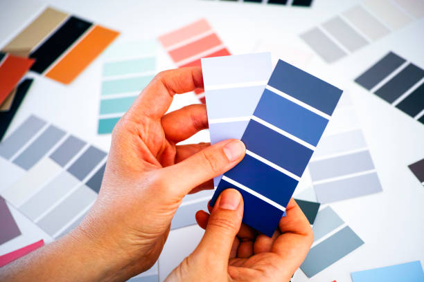 istock Woman hands choosing blue colour in sample palettes 1226729504
