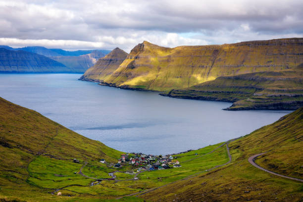 Panorama of mountains around village of Funningur on Faroe Islands Panorama of mountains around village of Funningur on Faroe Islands, Denmark. eysturoy photos stock pictures, royalty-free photos & images