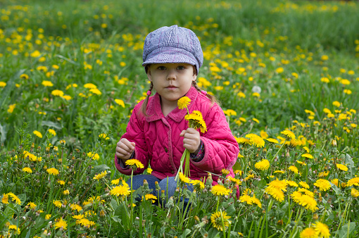 Hispanic girl on sunflower field