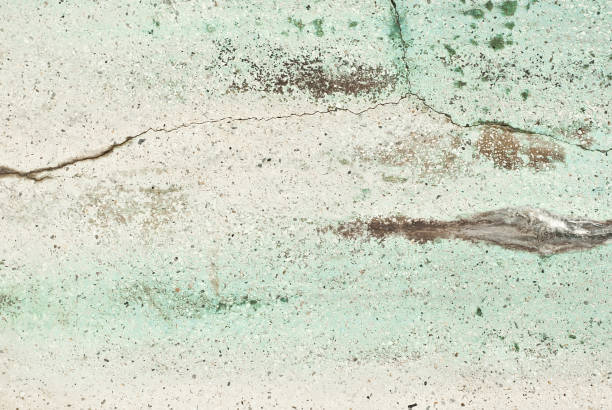 istock Texture of an old concrete wall with cracks. Green wall with scratches. 1226733890