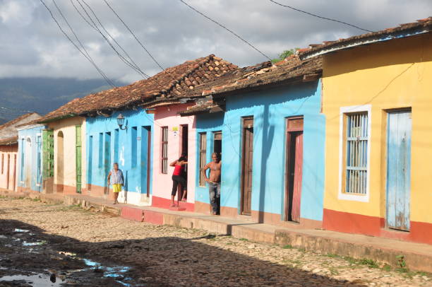 Colourful houses with occasionally quirky porches and cobbled streets give Trinidad lots of old world and small town charm. Windows and doors in Cuba are frequently colourful and designed to keep homes cool and ventilated whilst regulating the amount of light that gets in. Shown is a row of pastel coloured houses in the poorer part of Trinidad. Photos taken in Trinidad in January 2016.