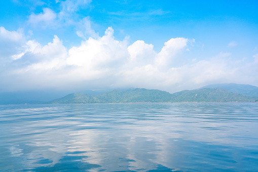 Blue sea and blue sky with sun