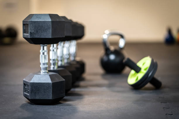 istock Row of dumbbell exercise weights on the floor 1226738974