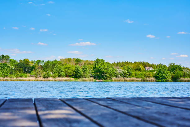 istock Blue and cloudy sky over a lake. 1226739159
