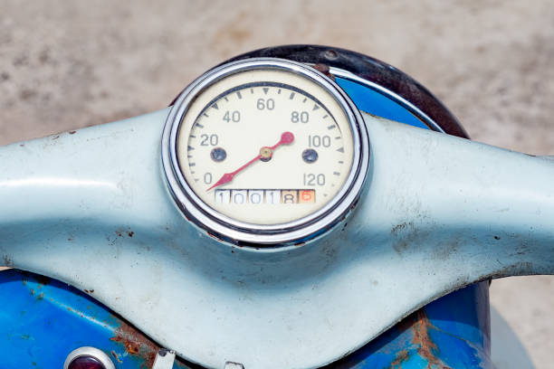 This photo shows a classic motorcycle dial. Reflected light is at the top of the dial shows that the motorcycle is in the garage.