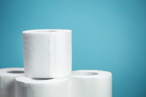 istock Toilet paper closeup on blue background 1226748341