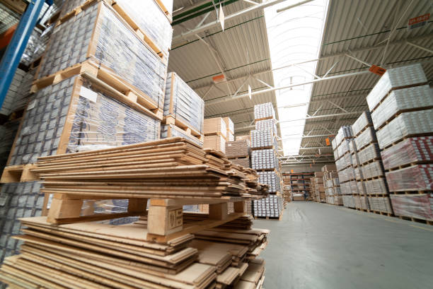 istock Huge distribution warehouse with boxes on high shelves. 1226748759