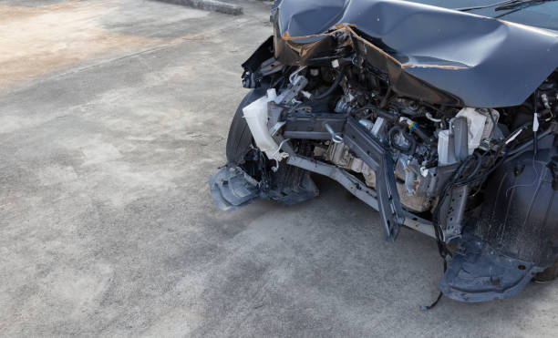 istock closeup car in front has been damaged by accident with soft-focus in the background. over light 1226749655