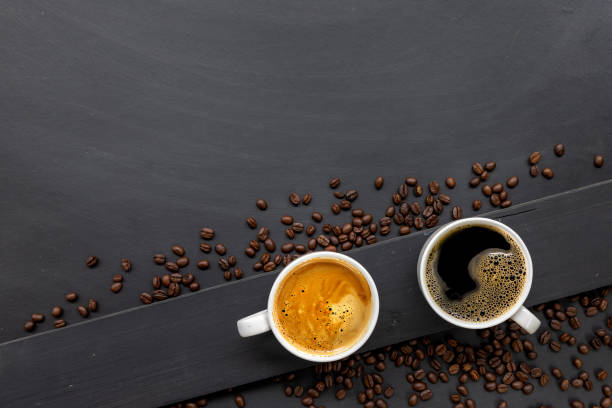 istock cup of coffee on black wooden floor background. top view. space for text 1226749708