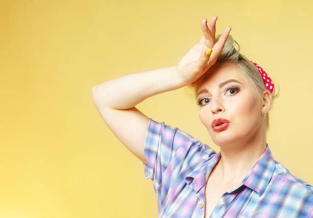istock beautiful blonde posing on a yellow background 1226750627