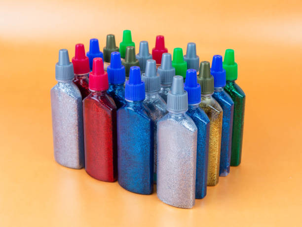istock Multi-colored tubes with glitter on a yellow background 1226756631
