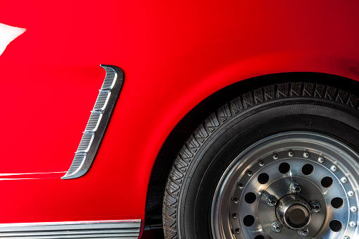 detail of a red vintage sports car