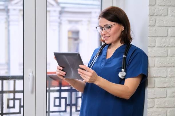 istock Female doctor talking online with patient using digital tablet, video call 1226756692