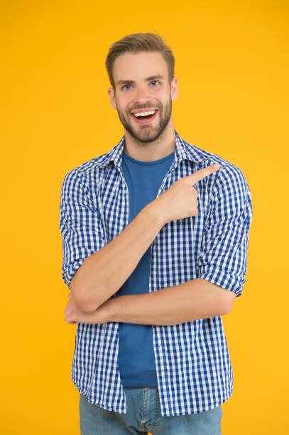 istock Choose this. Happy man pointing index finger. Pointing gesture and gesturing. Pointing for advertising. Pointing and promoting. Shopping and sale. Marketing and promotion. Presenting content 1226757598