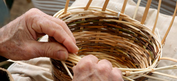 istock hands with arthrosis of the senior craftsman man while making a 1226759125