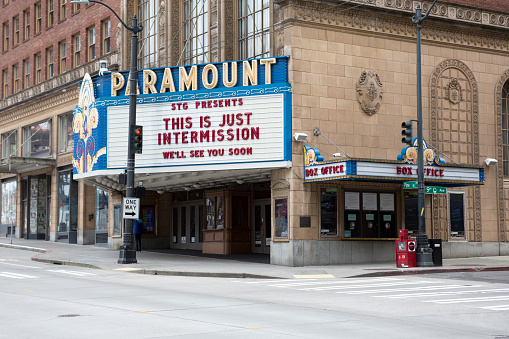 Downtown Seattle Washington during the pandemic COVID-19 outbreak.  The landmark Paramount Theater posts an inspirational sign during the outbreak.