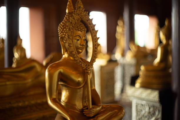 istock Golden Buddha statue hold talipot fan 1226761321