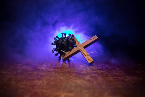istock Coronavirus 2019-nCov novel coronavirus concept. Crowd looking on big Corona virus model at night with fog and backlight. Creative artwork decoration. Selective focus. 1226762170